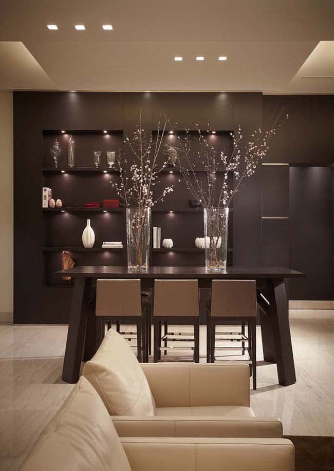 Dining room with dark brown accent wall