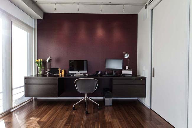 Home office with dark burgundy purple wall