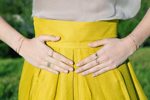 Jennie Kwon rings worn on on both hands with multiple styles per hand