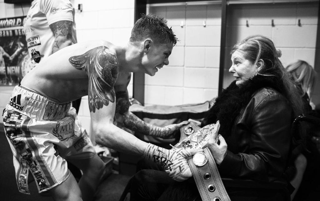 Charlie Edwards celebrates his world title win with his mother (Image: Matchroom).