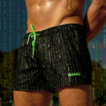 The Matrix Show Shorts for men by BANG Clothing Miami in a black color with green hidden messages.