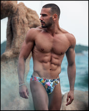 View of a sexy male model wearing Bang One swim brief print by Bang! Clothes in Miami 