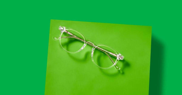 Korean style glasses on a green background