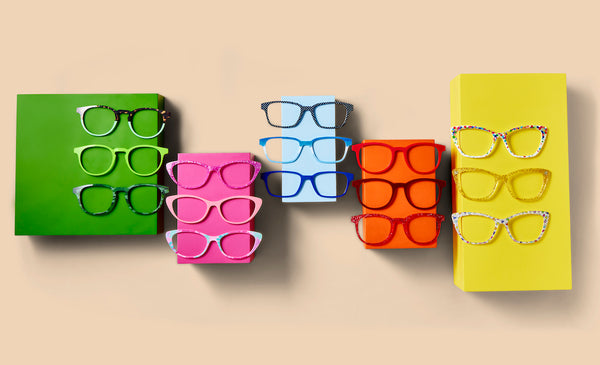 A variety of green, pink, blue, red, and yellow glasses on colorful backgrounds.