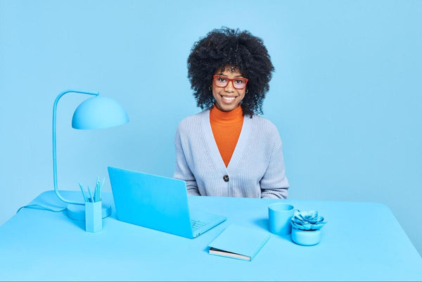 Square glasses frames: entrepreneur smiling at the camera