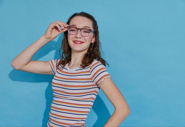 Girl posing and smiling at the camera