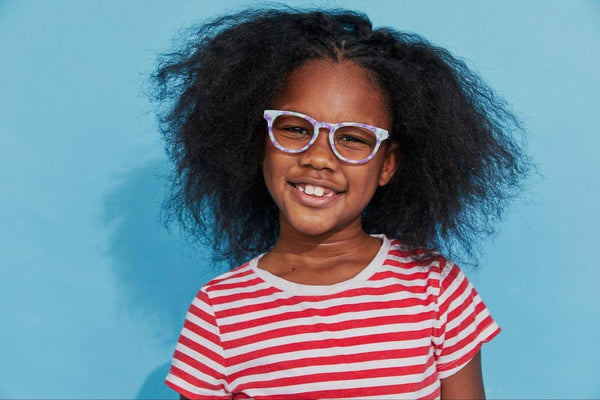 Girls glasses: girl wearing glasses and smiling at the camera