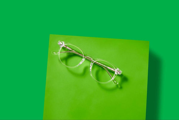 Glasses on a green background