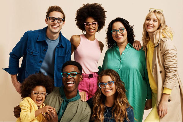 20/40 vision: A diverse group of smiling young people wearing glasses from Pair Eyewear.