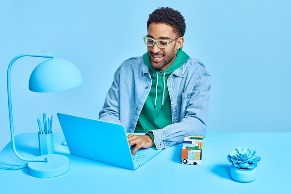 Man using a blue laptop