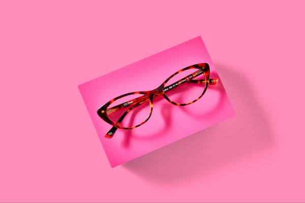 Pair Eyewear's best glasses for oval faces: tortoise cat-eye glasses on a pink background.