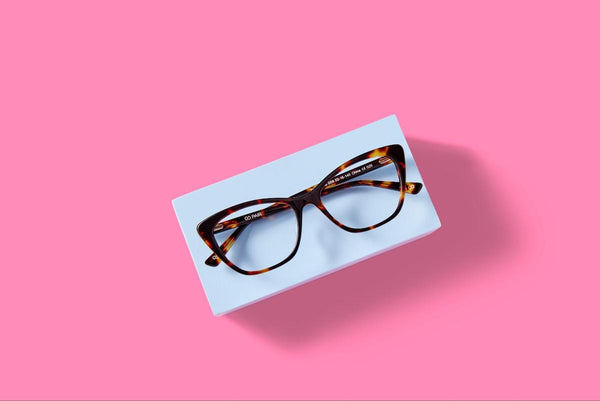 Affordable optical: pair of eyeglasses on a pink background