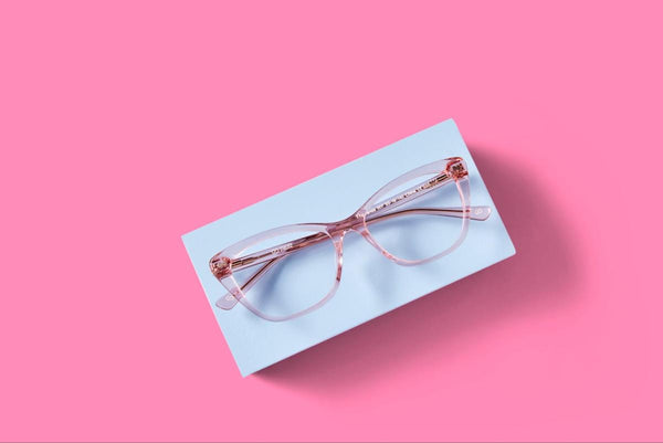 Clear style glasses: pink Wanda glasses on a white and pink background