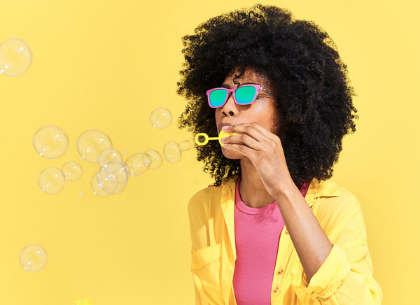 Woman blowing bubbles