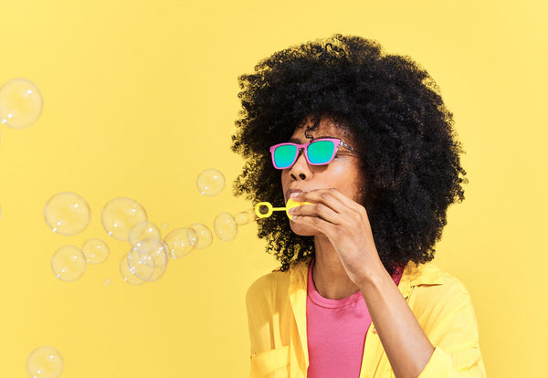 Woman blowing bubbles