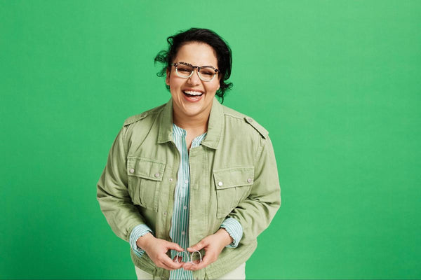 Vintage style glasses: woman happily wearing eyeglasses