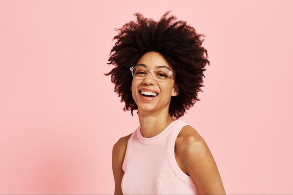 Clear style glasses: woman happily wearing the Finley glasses