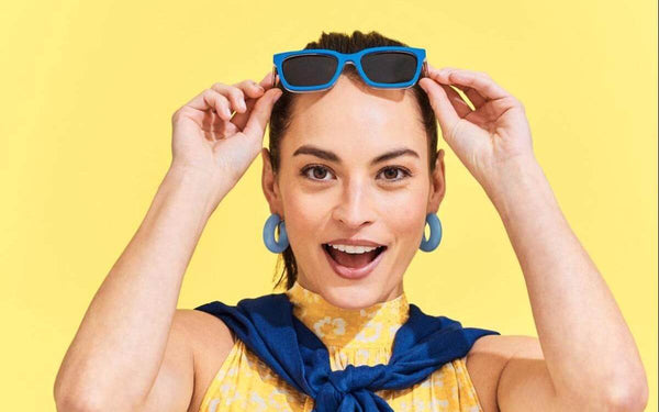 Woman putting her sunglasses on her head