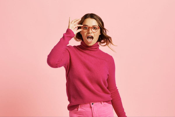 Woman wearing pink glasses