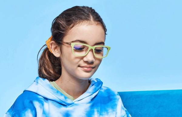 A young girl wearing Pair Eyewear's Otero kids prescription glasses.