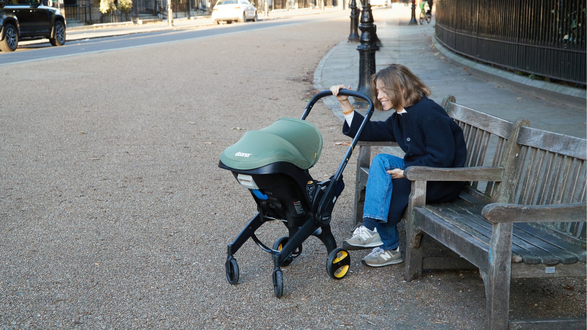 Woman with a Doona stroller/car seat