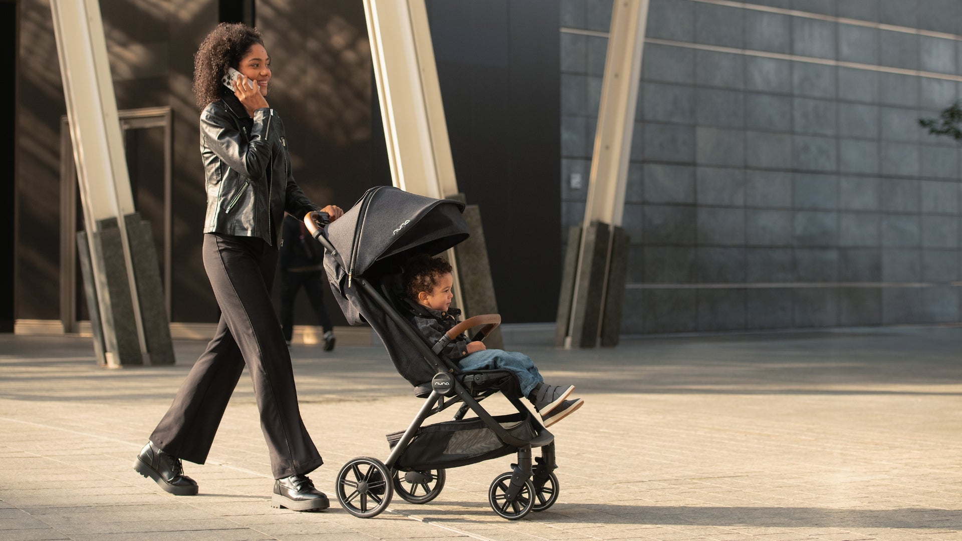 Woman pushing new Nuna TRVL lx