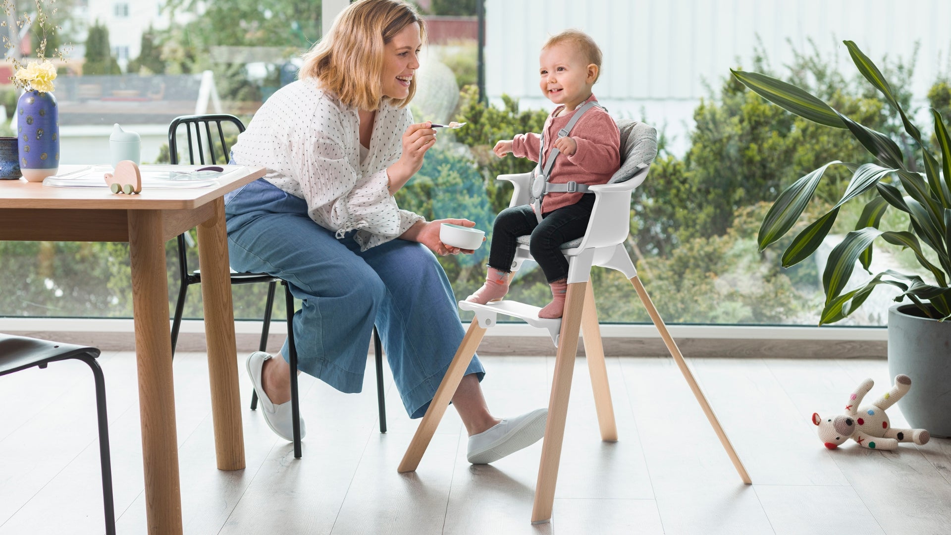 Stokke Clikk high chair with baby getting fed