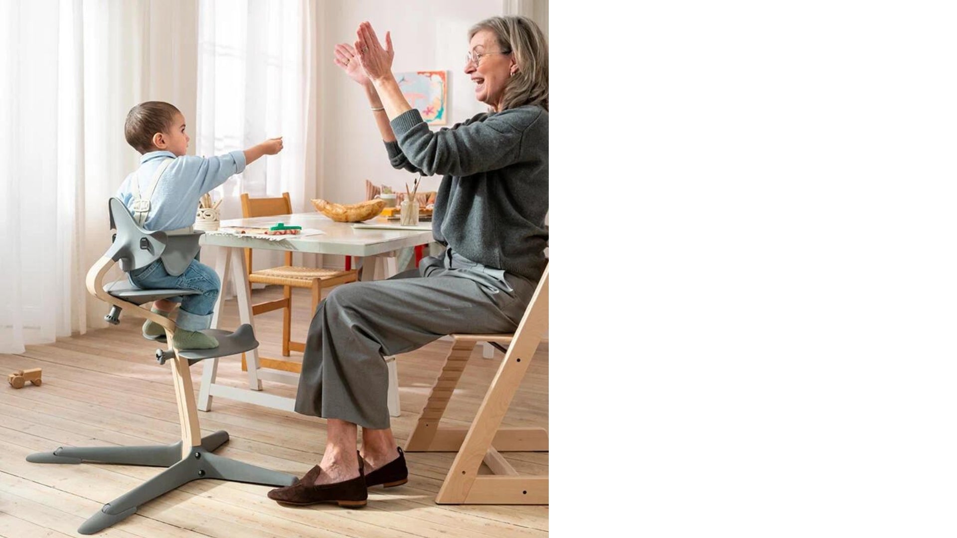 Grandma with child in Nomi high chair