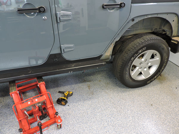 An ATV jack works best to raise and lower teh 75lb slides into place 