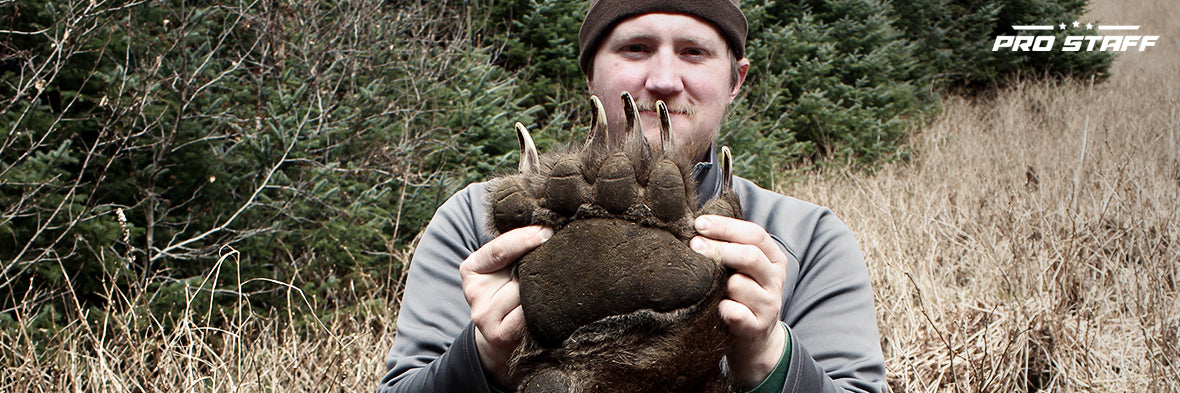 Tyler Freel holding a bear claw
