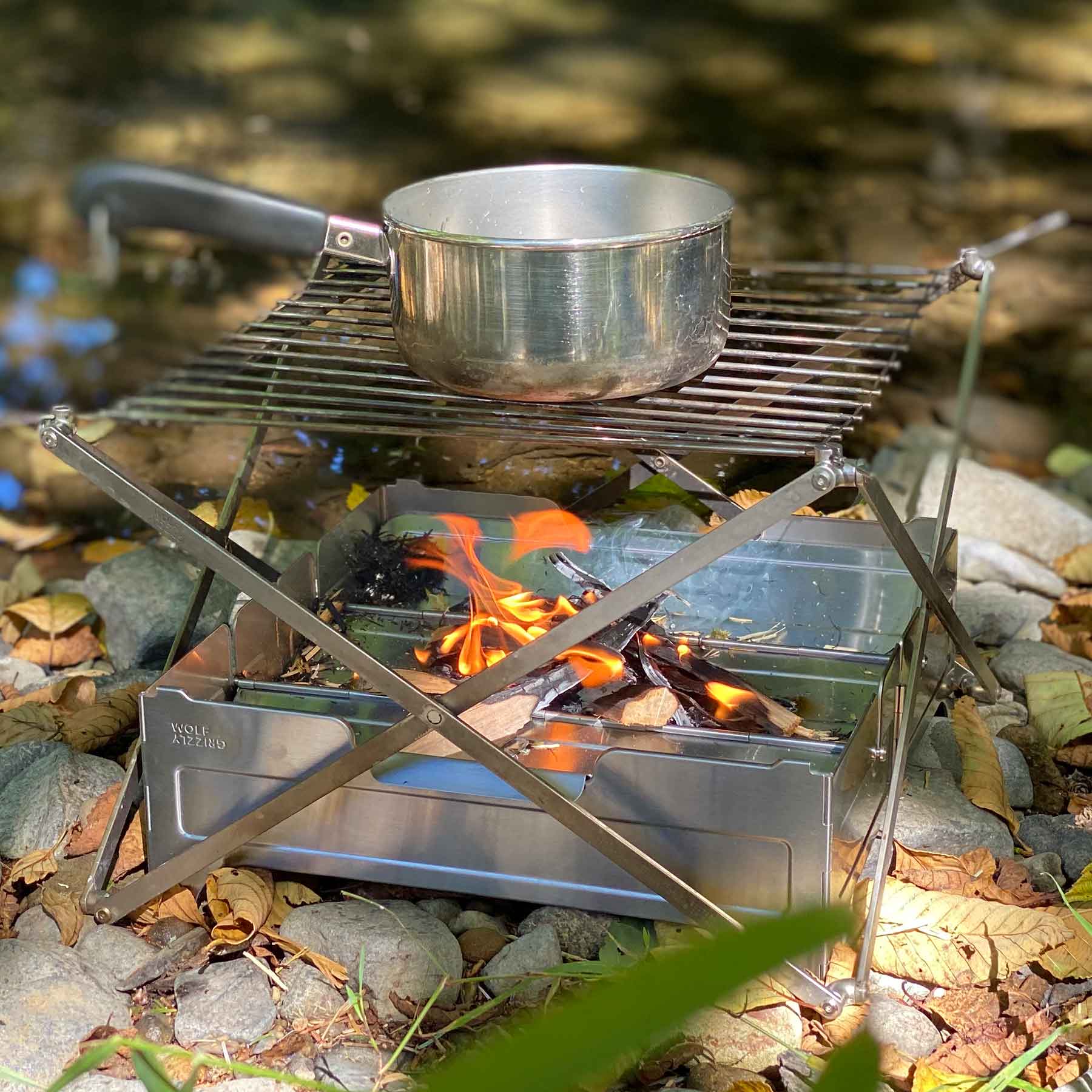 Portable fire pit and grill to boil water