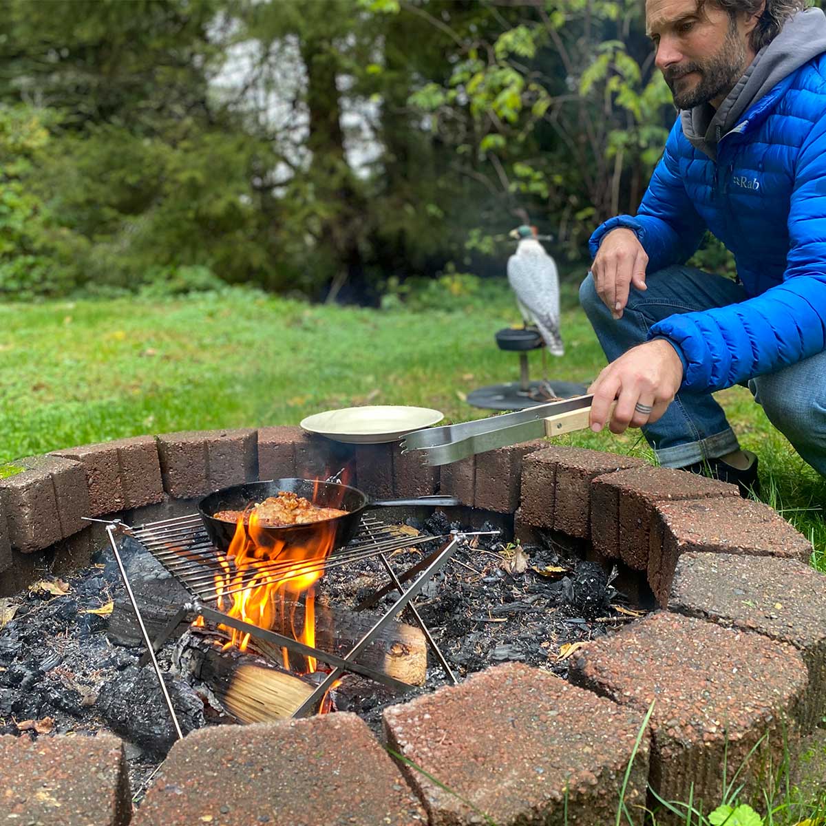 Cooking pheasant on campfire grill