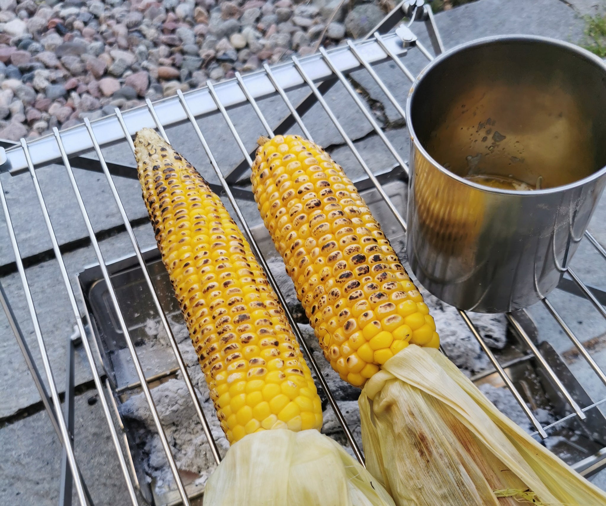 Grilled corn on the cob on top of the Wolf and Grizzly Grill