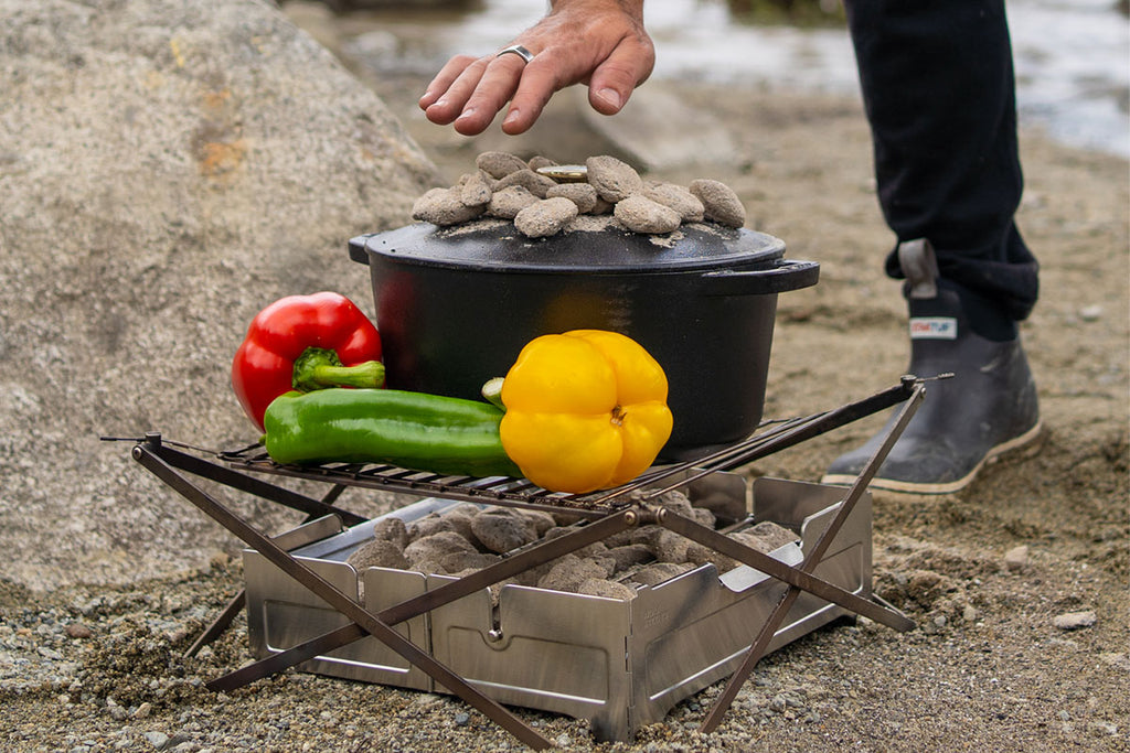 Cast-Iron Dutch Oven and fresh vegetables on BBQ grill