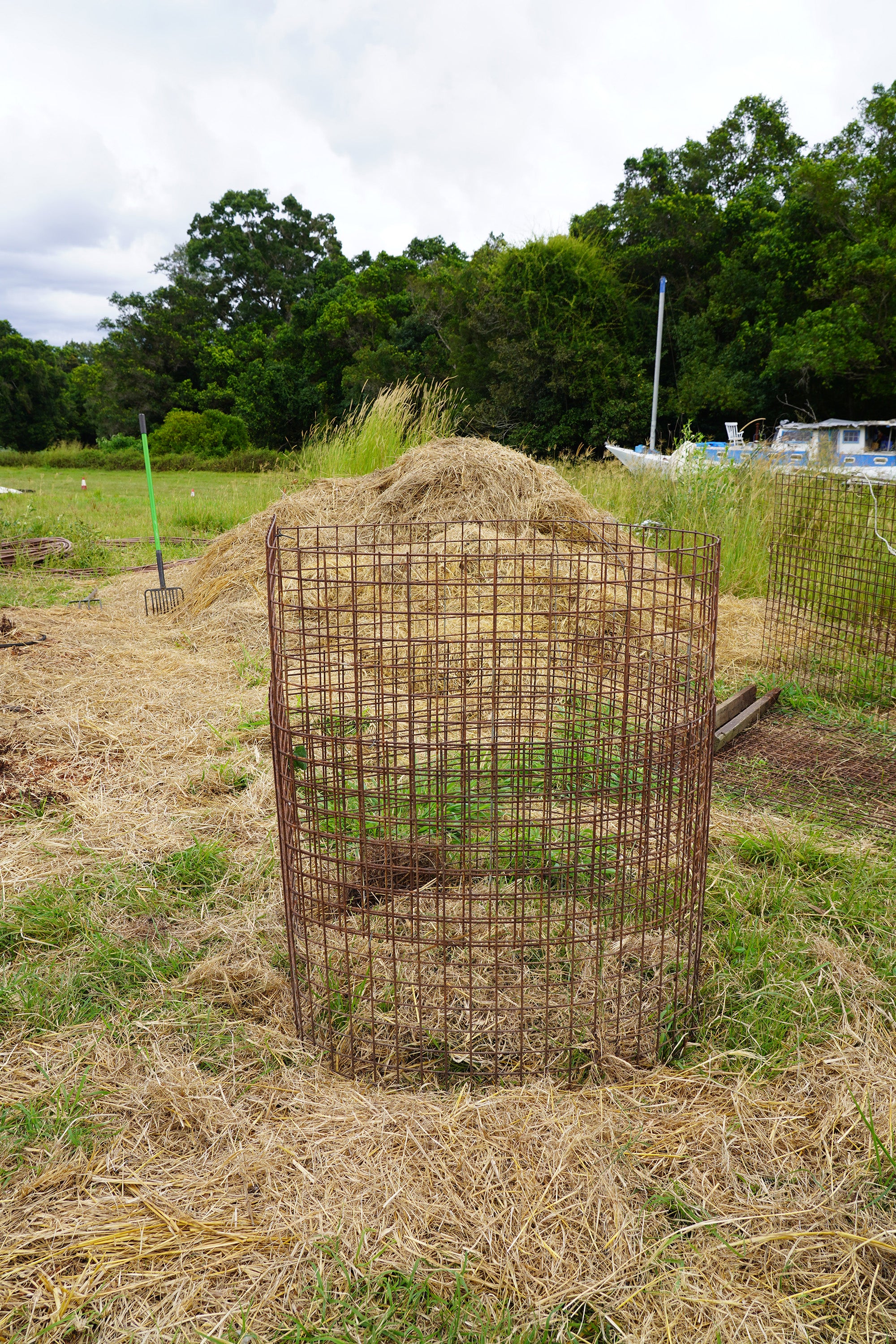 Wire cage to build the compost pile in
