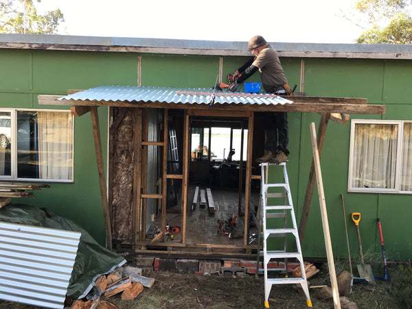 Mick Hellen on the tools, building the front door.