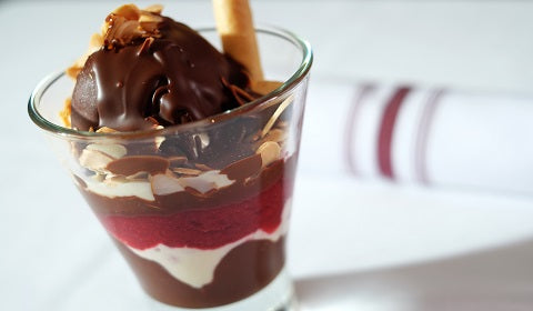 Ice cream parfait topped with chocolate is a favourite for all! 