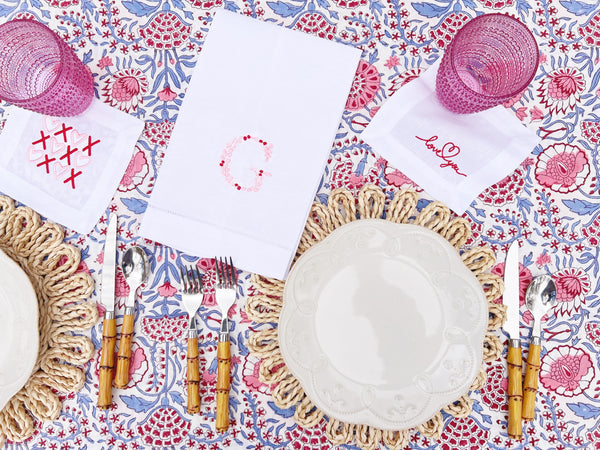Valentine's day brunch tablescape with embroidered linen tea towels for party favors and galentine gift