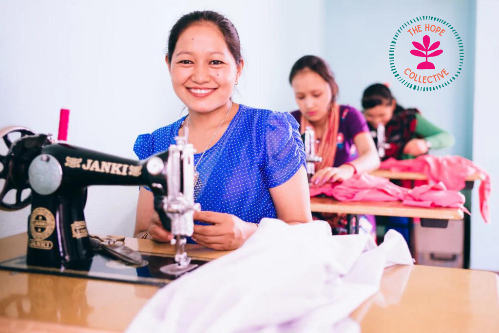 image of a girl in the program smiling, sitting at a sewing machine