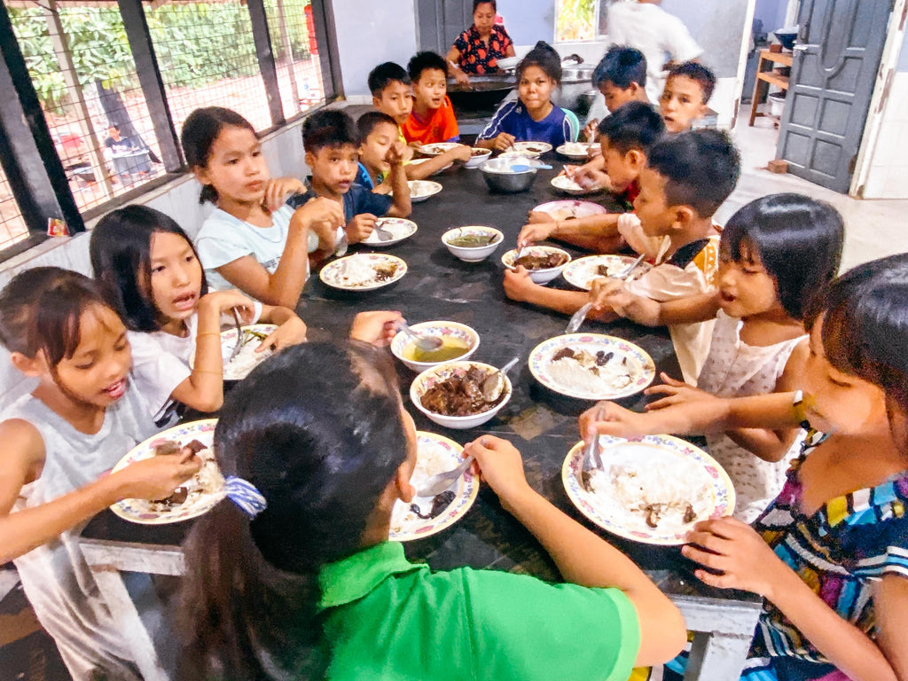 orphan children eating