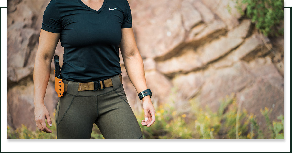  Image of woman wearing a tactical belt from Klik Belts.