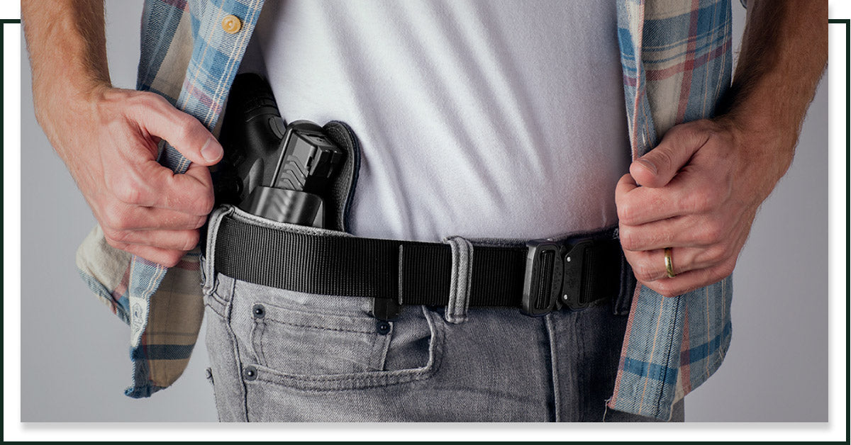 Image of a man concealed carrying with a gun belt from Klik Belts.