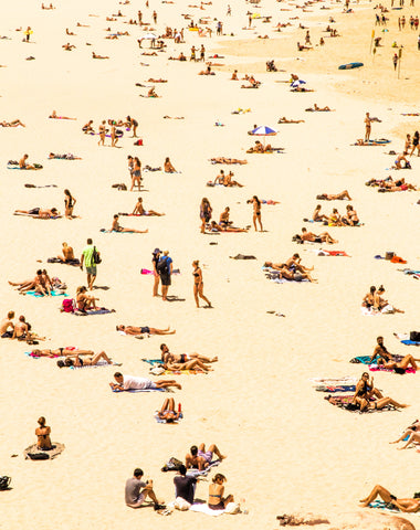 crowds tanning on beach