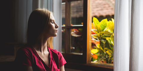 calm-woman-by-window