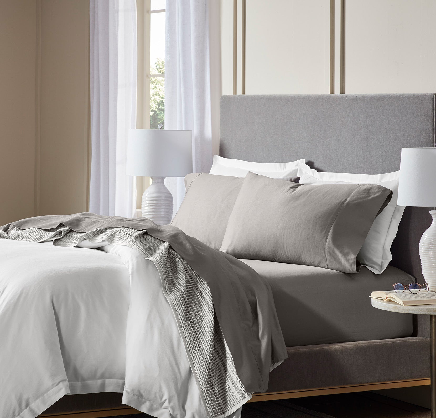Lifestyle image of bed made with Sheet Set in Stone