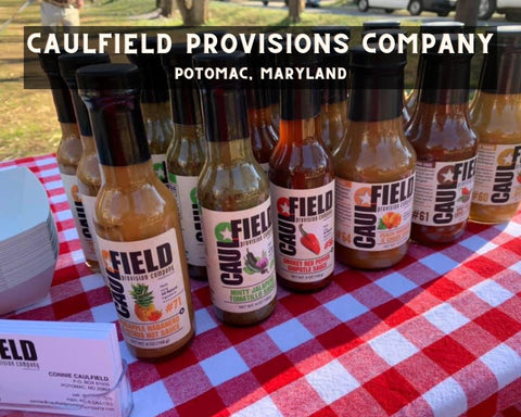 Caulfield Provisions Company, Group of Hot Sauces on Picnic Table