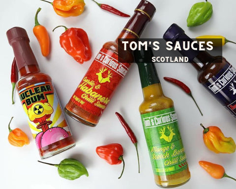 Group of Tom's Curious Sauces and Hot Peppers