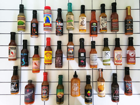 Wall of Dozens of Hot Sauce Bottles
