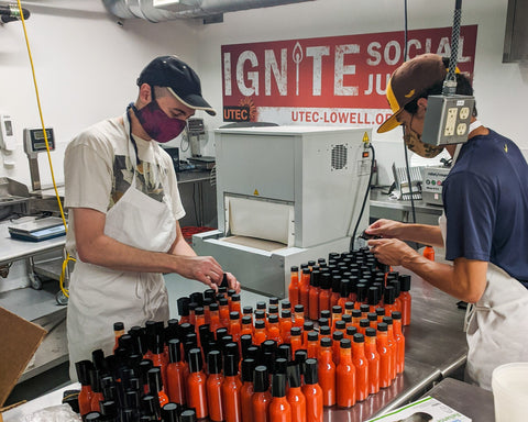 Picture of Two Craic Sauce Cooks Making A Batch of Mill City Red Hot Sauce