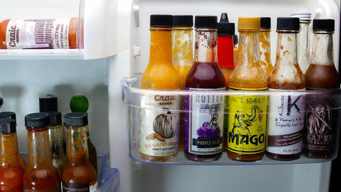 hot sauce collection in fridge